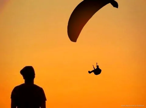 Sunrise hot air balloon flight before a Marrakech sunset paragliding day